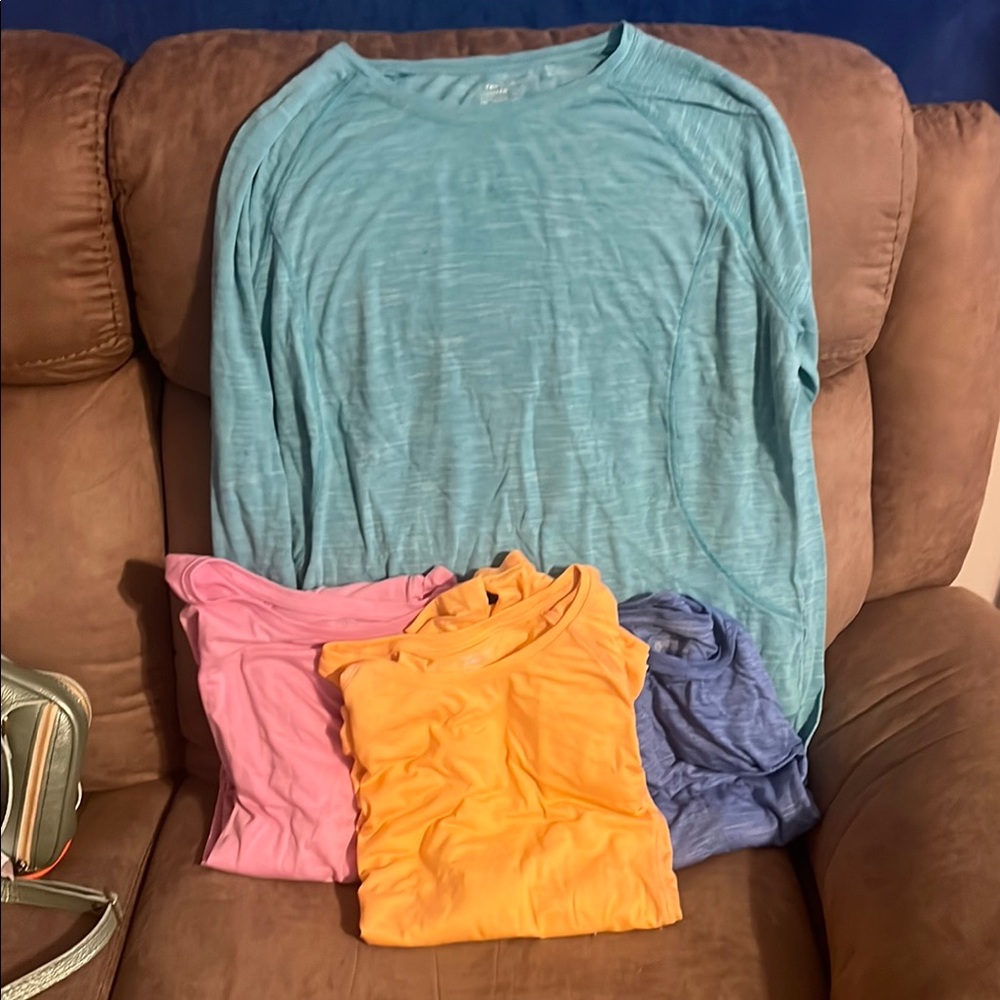 Tek Gear Blue , green , peach & pink shirts with thumb holes. Great for the gym